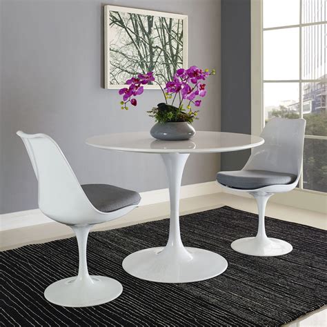 This round clear glass table top can be perfect if you are searching for a flat surface that may not stain. Lippa 40 Inch Round Wood Top Dining Table White by Modern Living