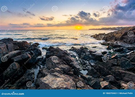 Beach Of The Sea At Sunset Wonderful Scenery With Stones In The Water