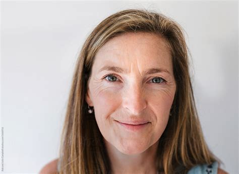 Healthy Mature Woman Looking At Camera With Plain Background By Rob