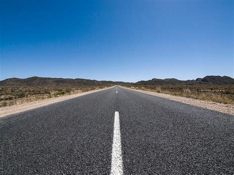 Lonely Desert Road By Stocksy Contributor Dv8or Stocksy