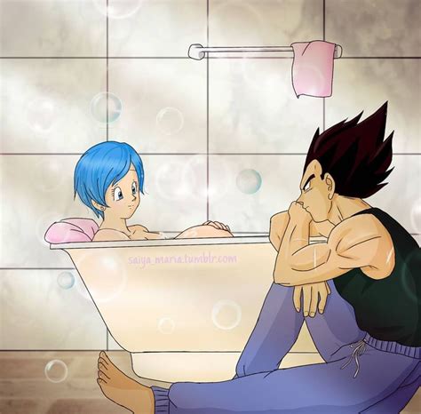 A Man Sitting On The Floor Next To A Woman In A Bathtub