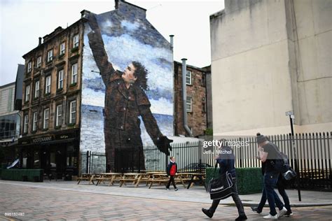 A Mural Of Comedian Billy Connolly Displayed On A Gable Wall In The