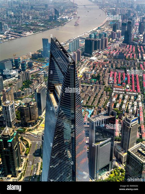 The Shanghai World Financial Center Towers Above Pudong In The