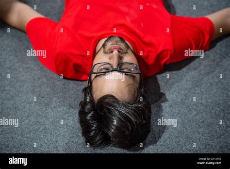 Exhausted Man Lying On The Ground Stock Photo Alamy