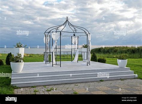 Iron Pavilion Decorated With White Cloths For A Wedding Ceremony On A