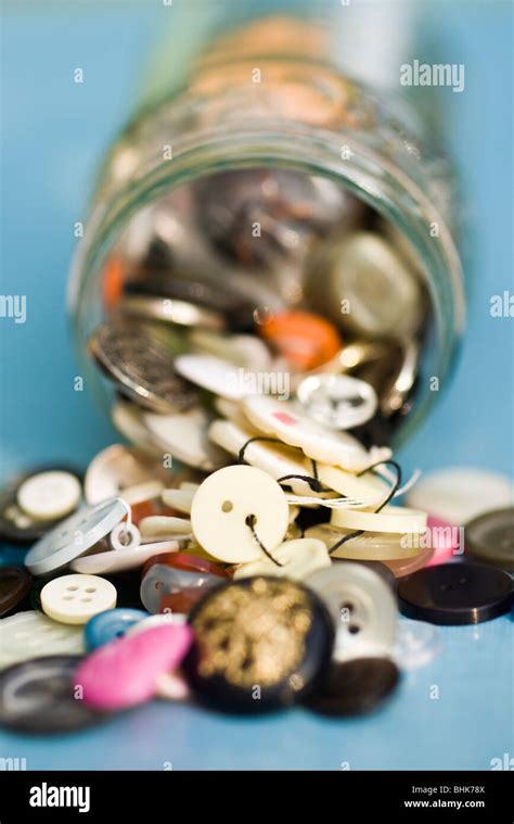 Buttons Spilling Out Of Jar Stock Photo Alamy