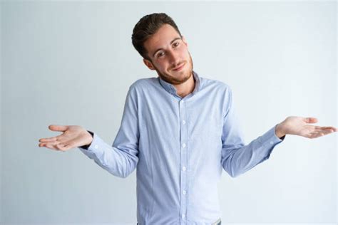 Man Shrugging His Shoulders Stock Photos Pictures And Royalty Free
