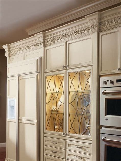 Surprisingly adding glass to your kitchen cabinets is one the easiest and least expensive ways to update your kitchen! #Decora's beautiful Kensington Art Glass Doors add a bit ...