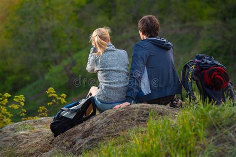 A Couple Take A Break While Backpacking On A Prepared Trail Stock Image
