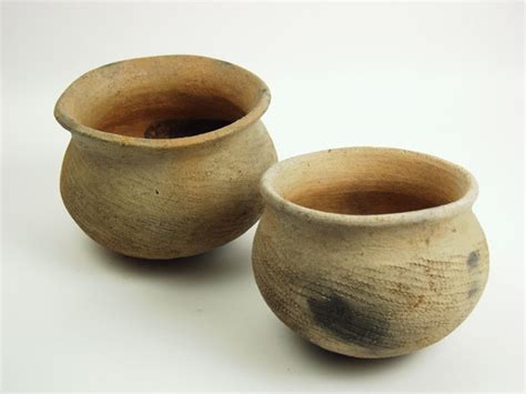Appealing for their traditional appearance and low cost. TWO AFRICAN CLAY POTS | #7142