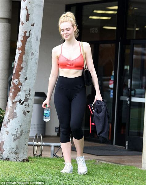 Elle Fanning Flashes Toned Torso In Orange Sports Bra Daily Mail Online