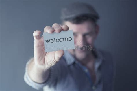 Man Showing A Card With The Word Welcome Stock Image Image Of