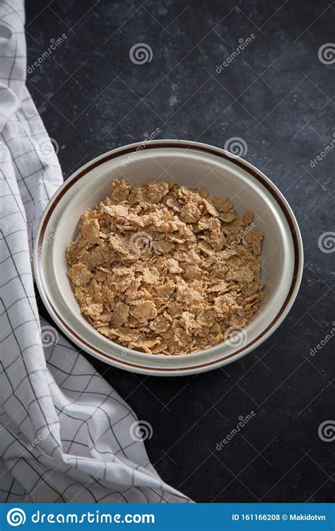 Wheat Bran Breakfast Cereal With No Milk In A Bowl Black Background