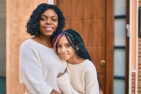Beautiful African American Mother And Daughter Smiling Happy And
