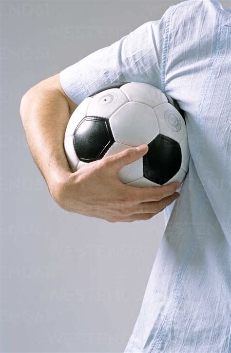Man Holding Soccer Ball Stock Photo