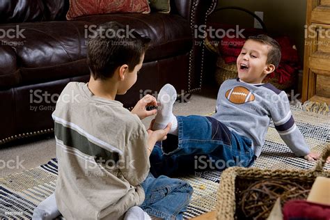 Young Boy Laughing At Tickled Feet Shallow Focus Stock Photo - Download ...
