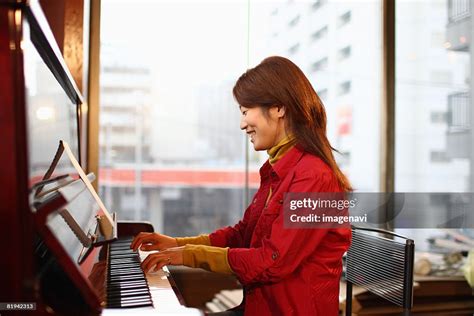 Young Woman Playing The Piano High Res Stock Photo Getty Images