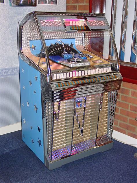 An Old Fashioned Jukebox With Many Items Inside It And Stars On The Sides