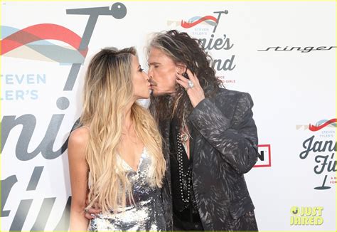 Steven Tyler And Girlfriend Aimee Preston Share A Smooch At Grammy