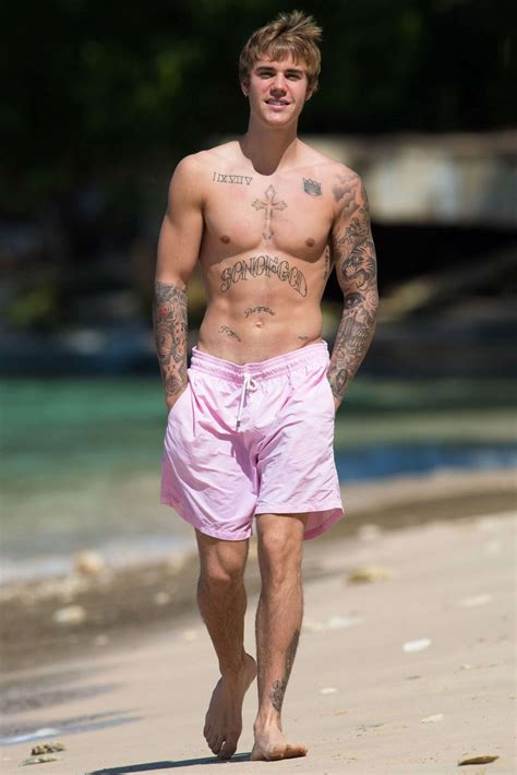 Justin Bieber Looks Buff While Taking A Shirtless Beachside Stroll In