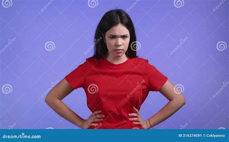 Angry Offended Woman Keeping Arms Crossed And Staring At Camera With