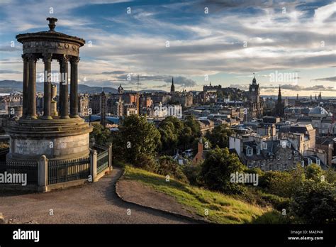 The Dugald Stewart Monument On Calton Hill With View Of City Skyline At