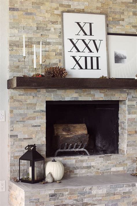 Choosing an electric wall mounted fireplace can help free up space in your room by attaching to the wall. The evolution of our living room fireplace {+ more fall decorating} | Stacked stone fireplaces ...