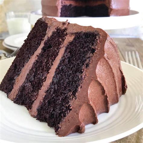 A Slice Of Chocolate Cake On A White Plate