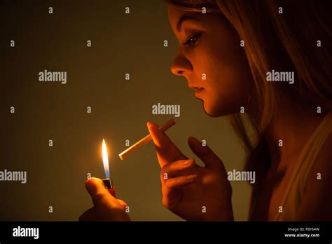 Young Woman With Lighter Lighting Up Cigarette Girl Smoking Stock