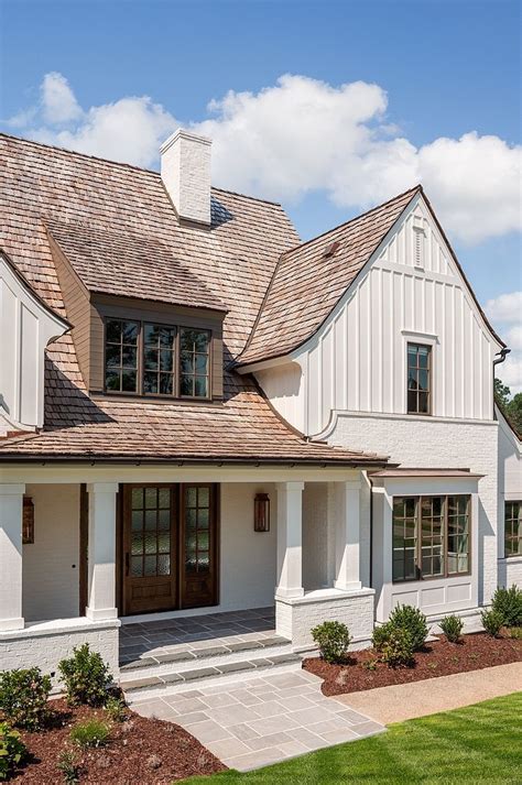 Modern Farmhouse Exterior With Classic Elements Such As Painted Brick