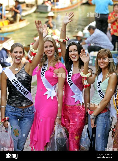 miss universe 2005 contestants wave at onlookers during visit to floating markets in thailand s