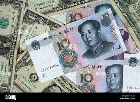 Chinese Renminbi Rmb On Top Of Usa Dollars Banknotes Stock Photo Alamy