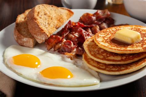 Traditional Full American Breakfast Eggs Pancakes With Bacon And Toast