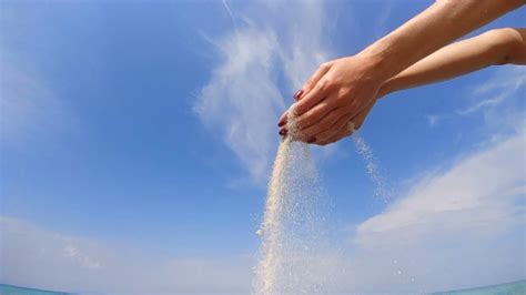 The Hands Pouring The Sand In The Sea Slow Motion Stock Video Footage