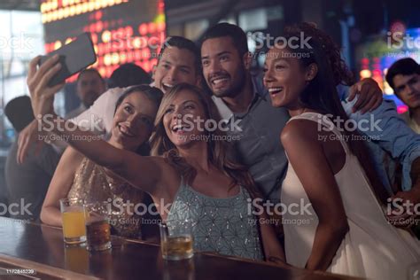 Group Of Friends Taking A Selfie While Partying At A Nightclub Stock