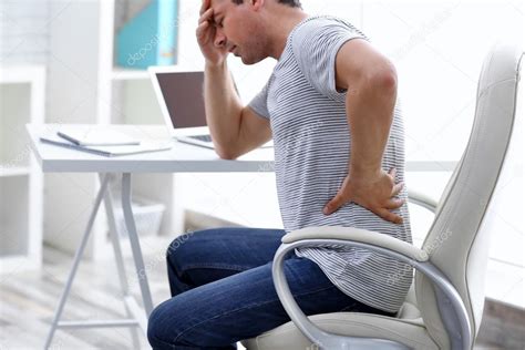 Man Suffering From Back Pain — Stock Photo © Belchonock 118559634