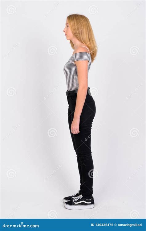 Full Body Shot Profile View Of Young Beautiful Blonde Teenage Girl
