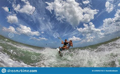 Couple Up On One Kite Board Woman Riding On Kite Surfer`s Back And