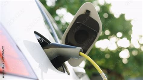Close Up Of Electric Vehicle Charging Port Plugging In Ev Modern Car