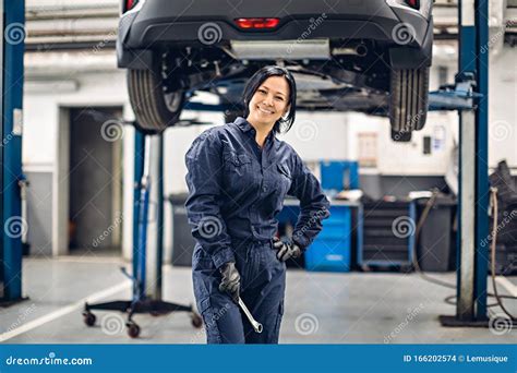 Auto Car Repair Service Center Happy Female Mechanic Standing By The