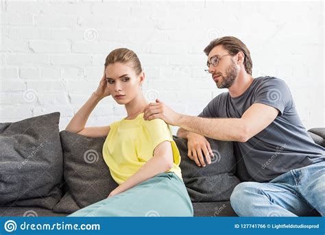 Young Man Trying To Cheering Up Upset Girlfriend Stock Photo Image Of