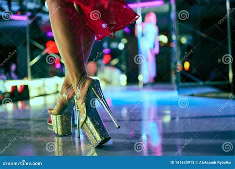 Heels Of Woman Pole Dancing Or Striptease Pylon In Night Club Stripper Girl Background Stock