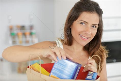Portrait Of A Beautiful Woman Grocery Shopping With Shopping Bags