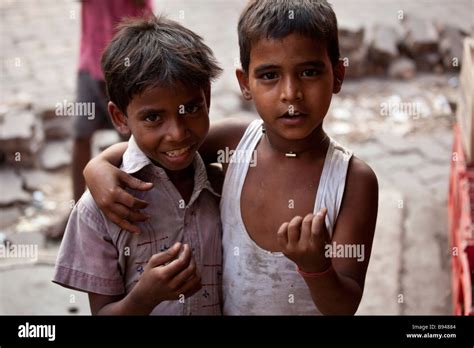Two Poor Homeless Boys Begging In The Streets Of Calcutta India Stock