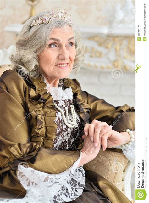Senior Woman Sitting In Vintage Chair Stock Photo Image Of Recollection Golden