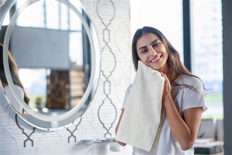 Woman Drying Her Skin With A Towel After Spa Procedures Stock Image