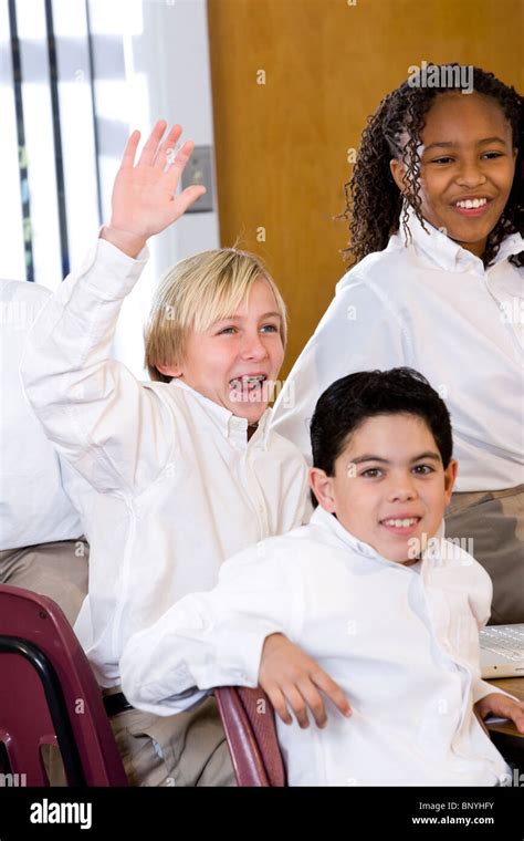 Diverse Classroom Boy Raising Hand Stock Photo Alamy