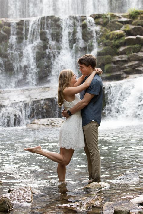 Engagement Shoot In Front Of Waterfall Couple Photoshoot Poses Couple Photography Poses