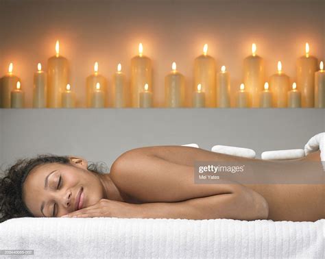 Young Woman Lying On Treatment Table Receiving Lastone Therapy High Res