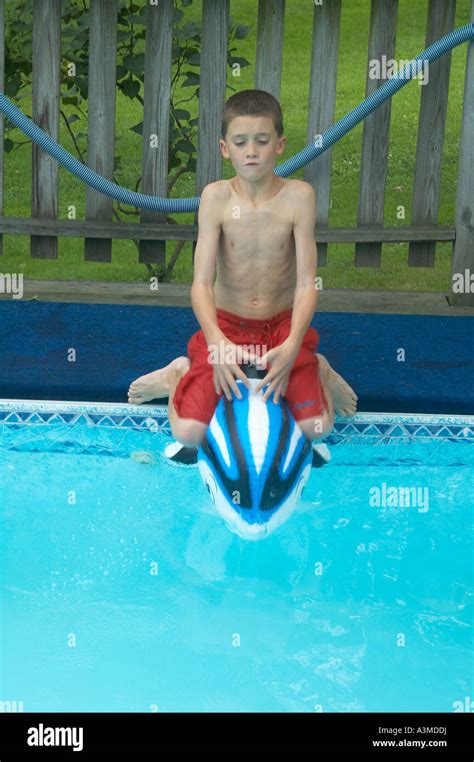 1 One Young 8 9 Eight Nine Year Old Boy Enjoys Swimming Pool Inflatable